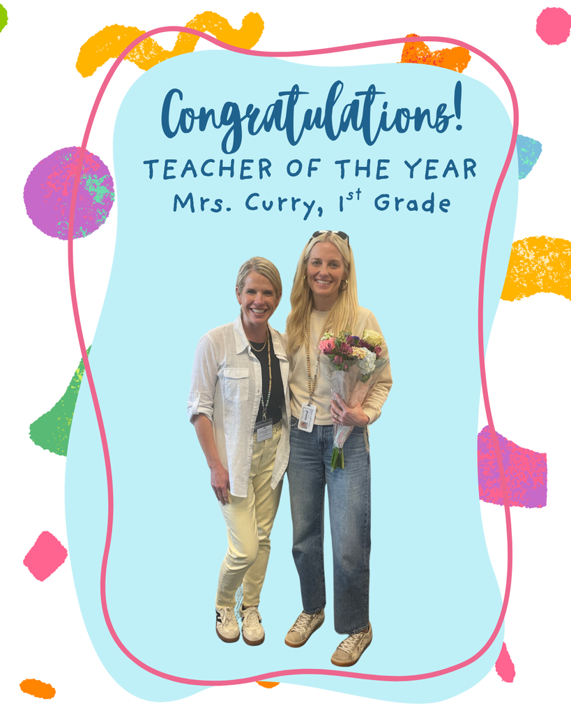 principal and teacher of the year standing together with flowers