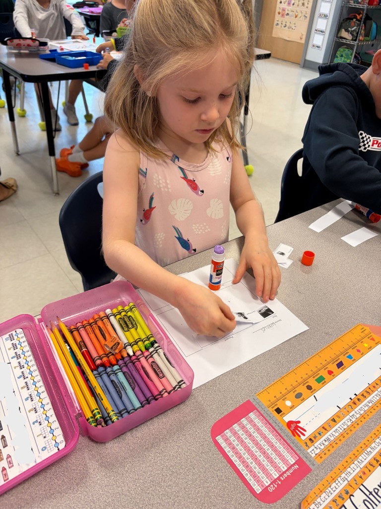 Kindergarten students working at their tables