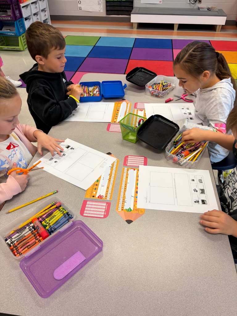 Kindergarten students working at their tables