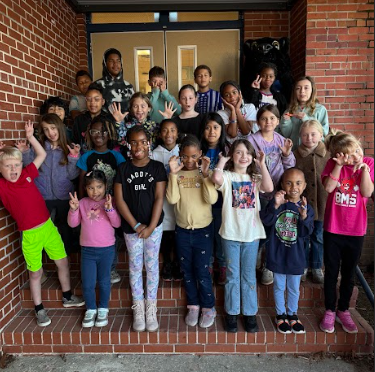 students of the week with silly faces and gestures being made