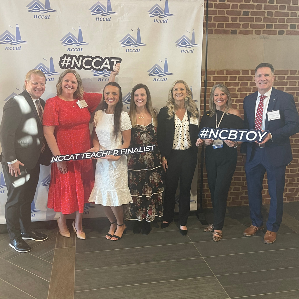 BT receiving award with other educators