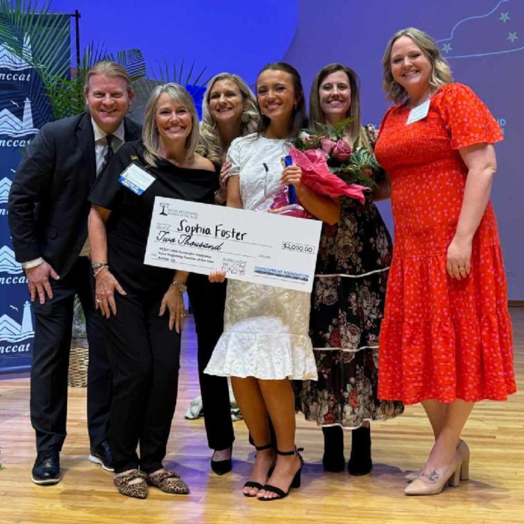 BT receiving award with other educators