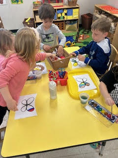 PreK working on a spring activity at their tables