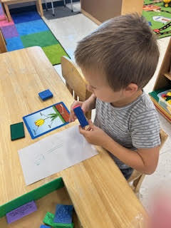 PreK working on a spring activity at their tables