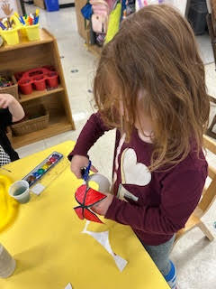 PreK working on a spring activity at their tables