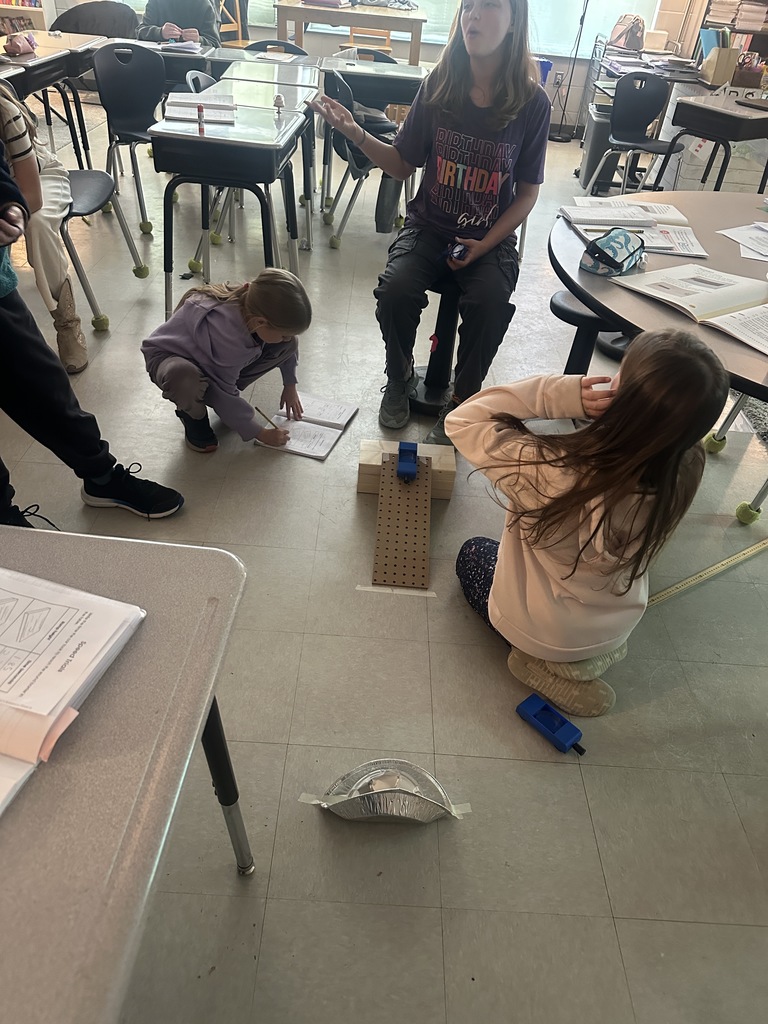 4th graders working on a science experiment 