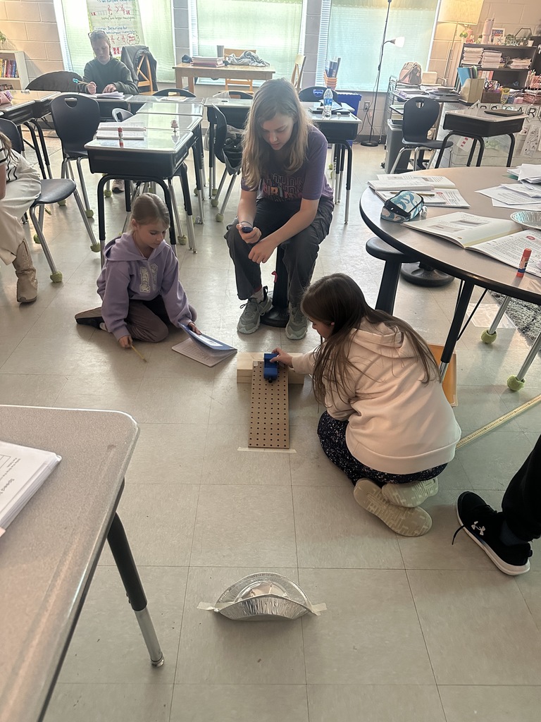 4th graders working on a science experiment 