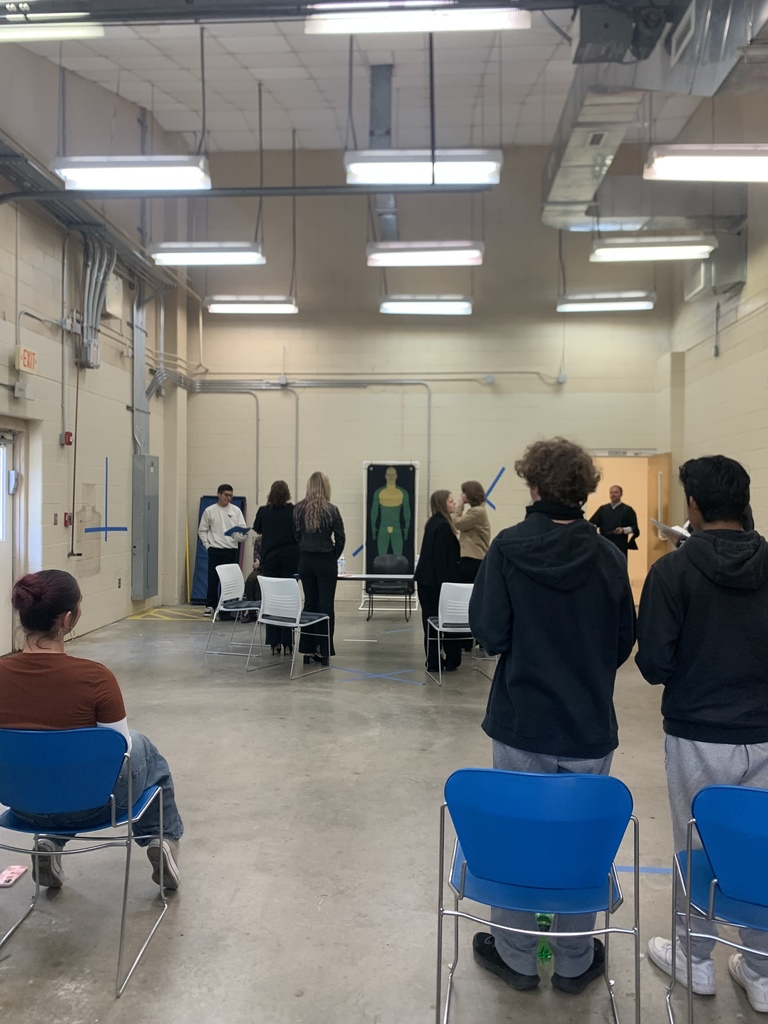 Picture of students standing up during a mock trial