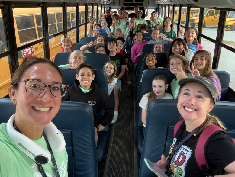 5th grade students on a bus