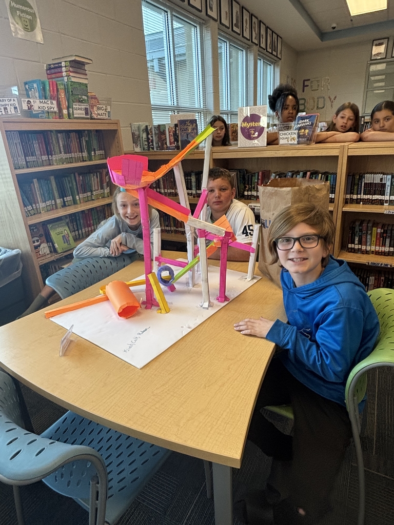 5th grade groups testing their paper rollercoaster designs