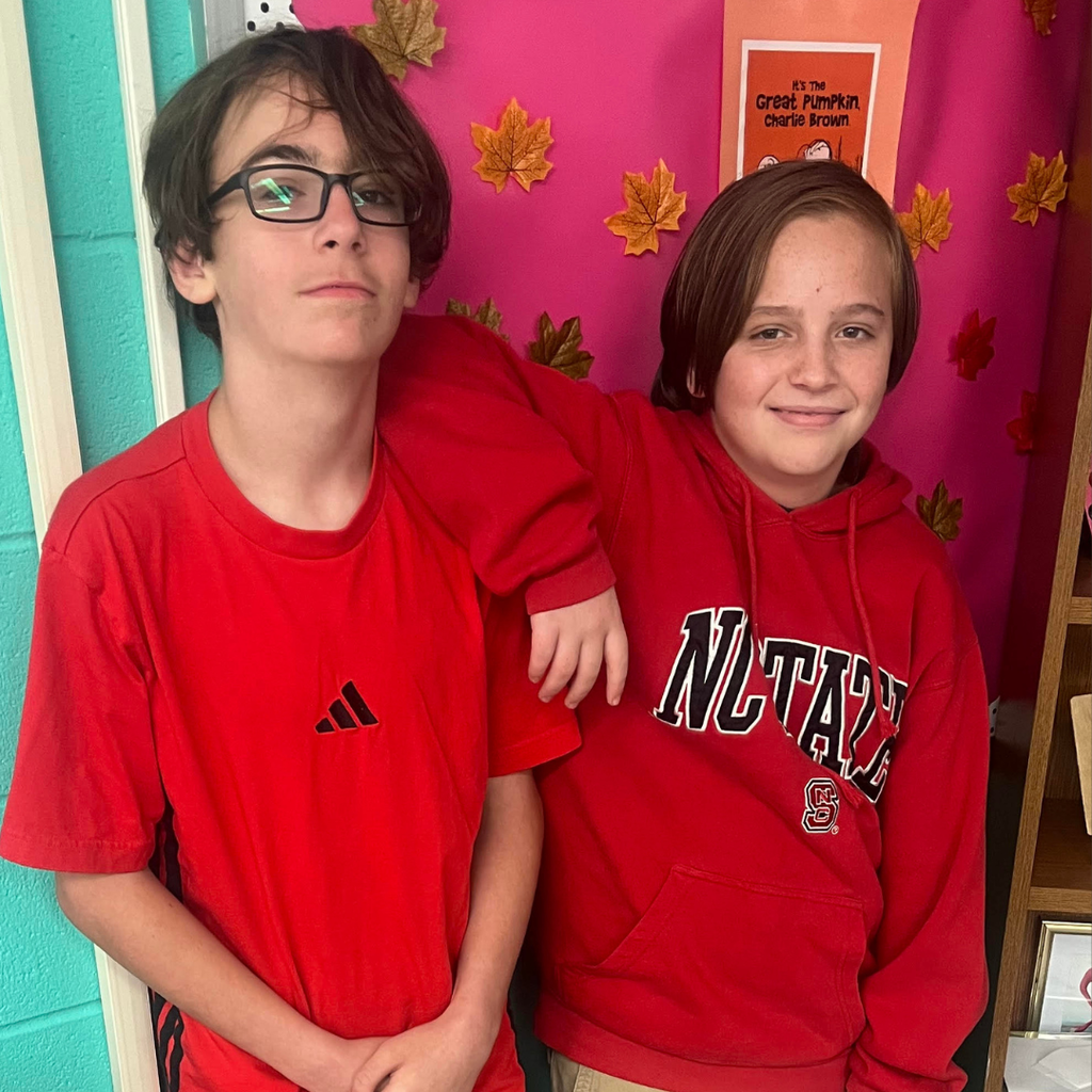 students posing in school colors 