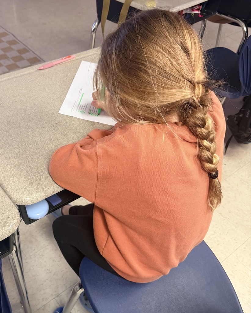 third grade students working on EOG review