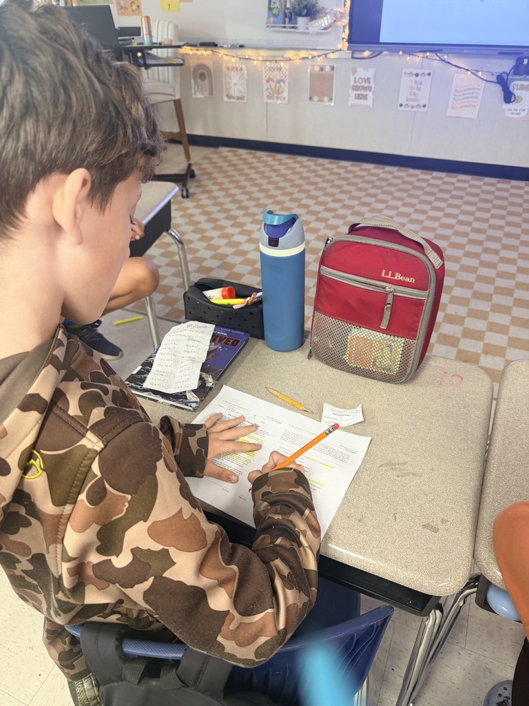 third grade students working on EOG review