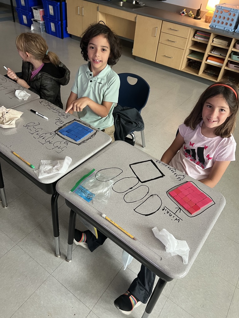 2nd graders making arrays with square tiles