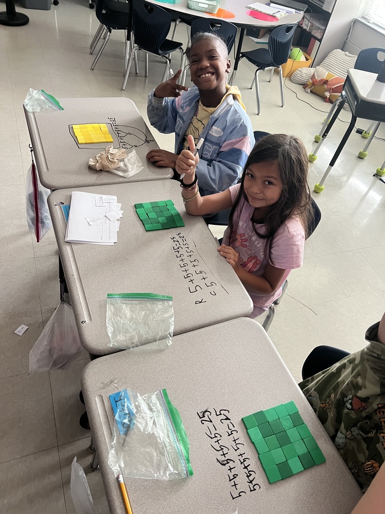 2nd graders making arrays with square tiles