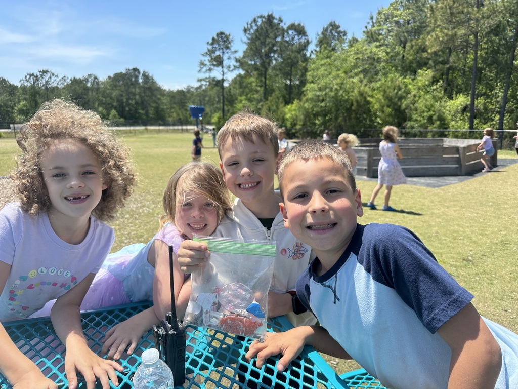 students collecting trash on the playground