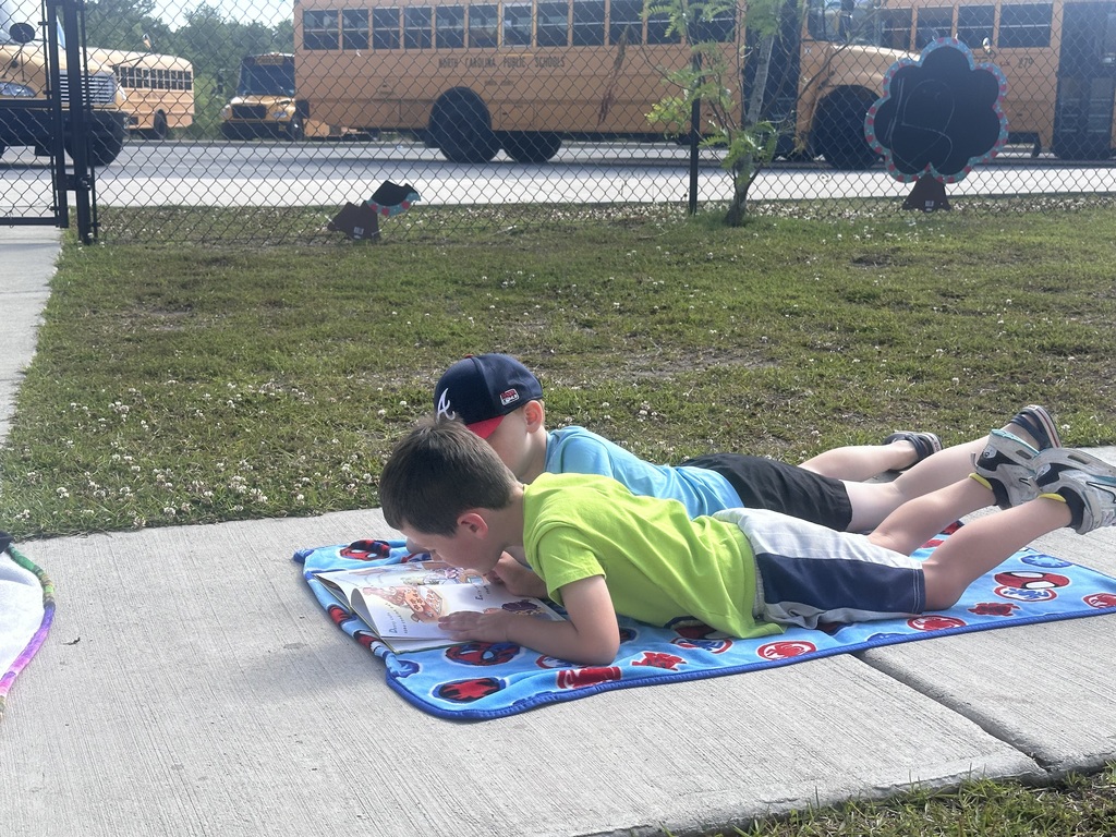 prek students reading outside