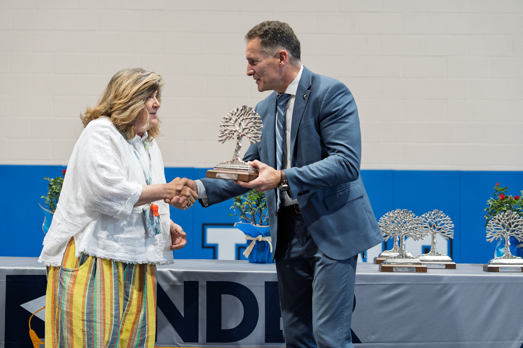 Mrs. Radcliff shaking hands with Dr. Bredlove at the PCS Retirement Celebration.