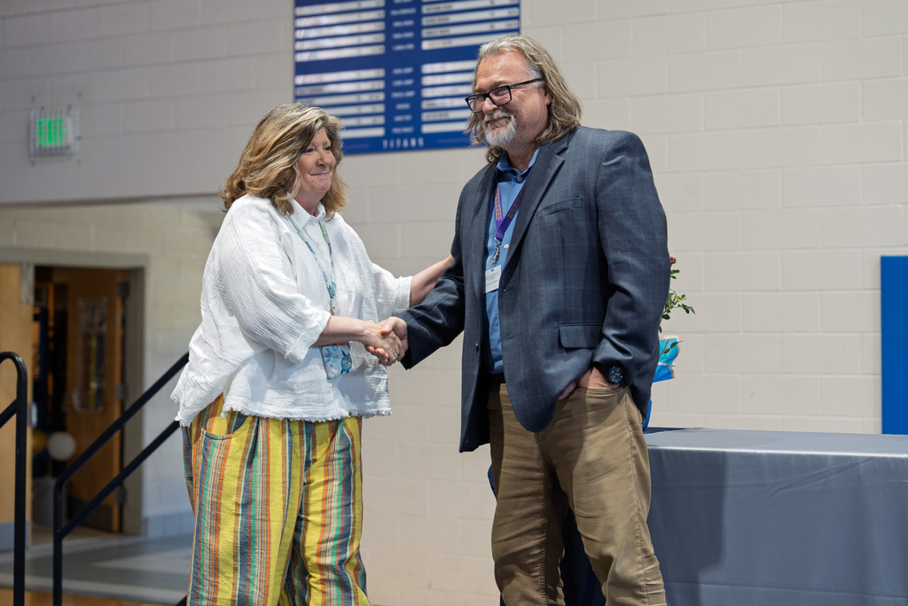 Mrs. Radcliff shaking hands with Mr. Taylor at the PCS Retirement Celebration.