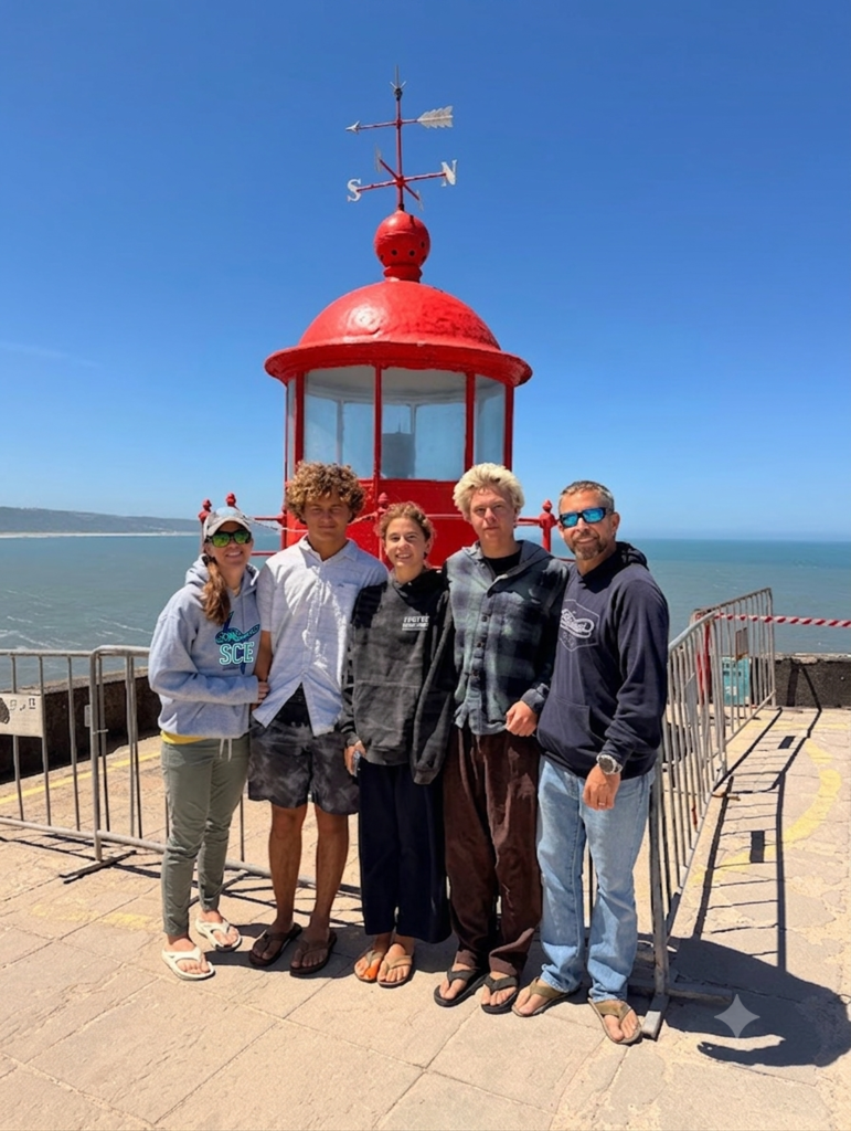 family standing on the shore in Portugal