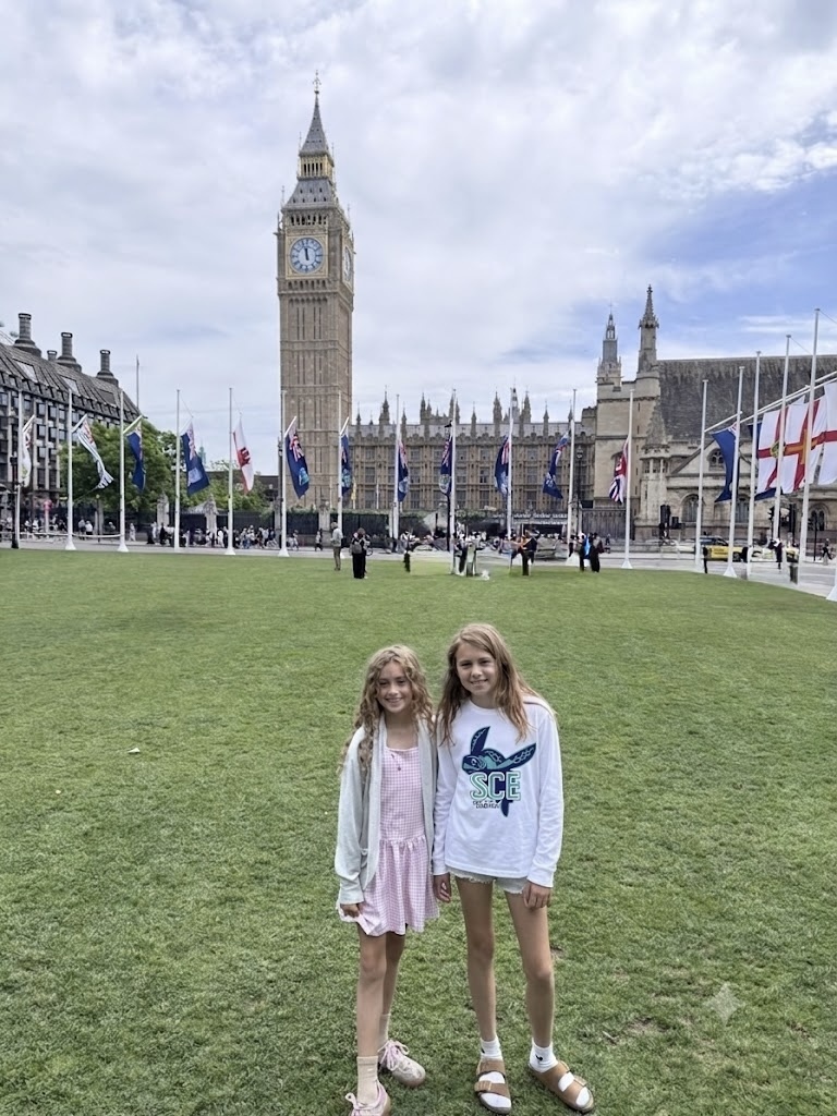 two students posing wearing surf city elementary tshirts