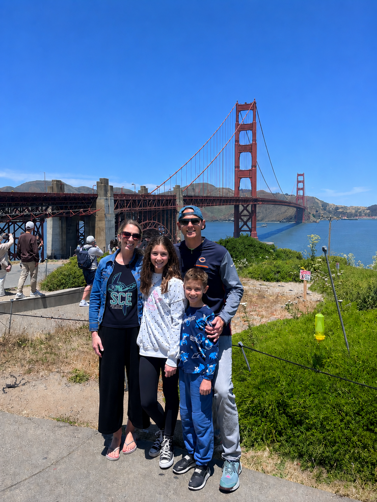 teacher and her family posing for a picture wearing a SCE tshirt