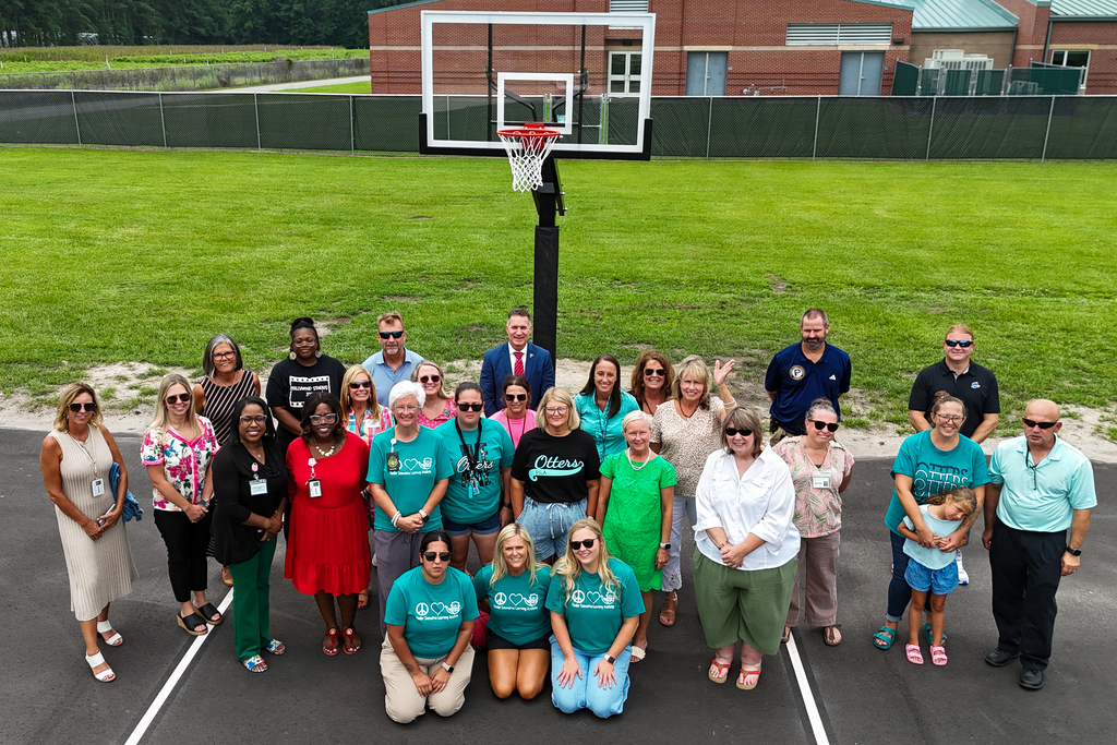 basketball court ribbon cutting at pender innovative learning academy