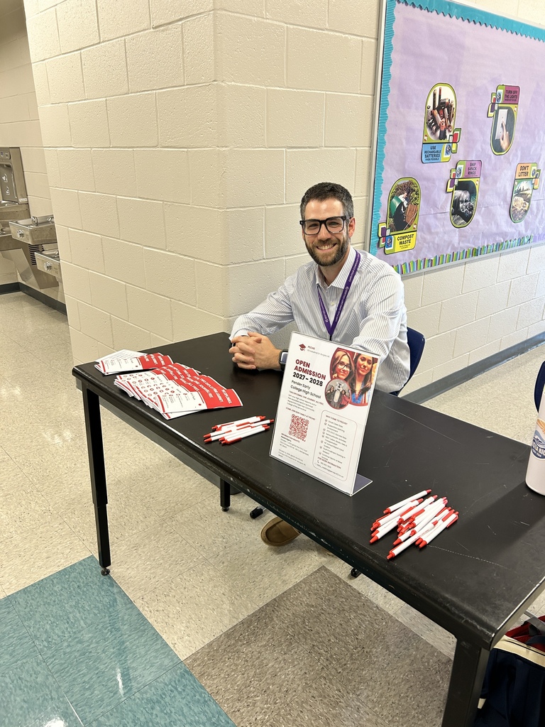 Image shows math teacher Mr. Scheinfeld at the PECHS table at Cape Fear Middle's open house