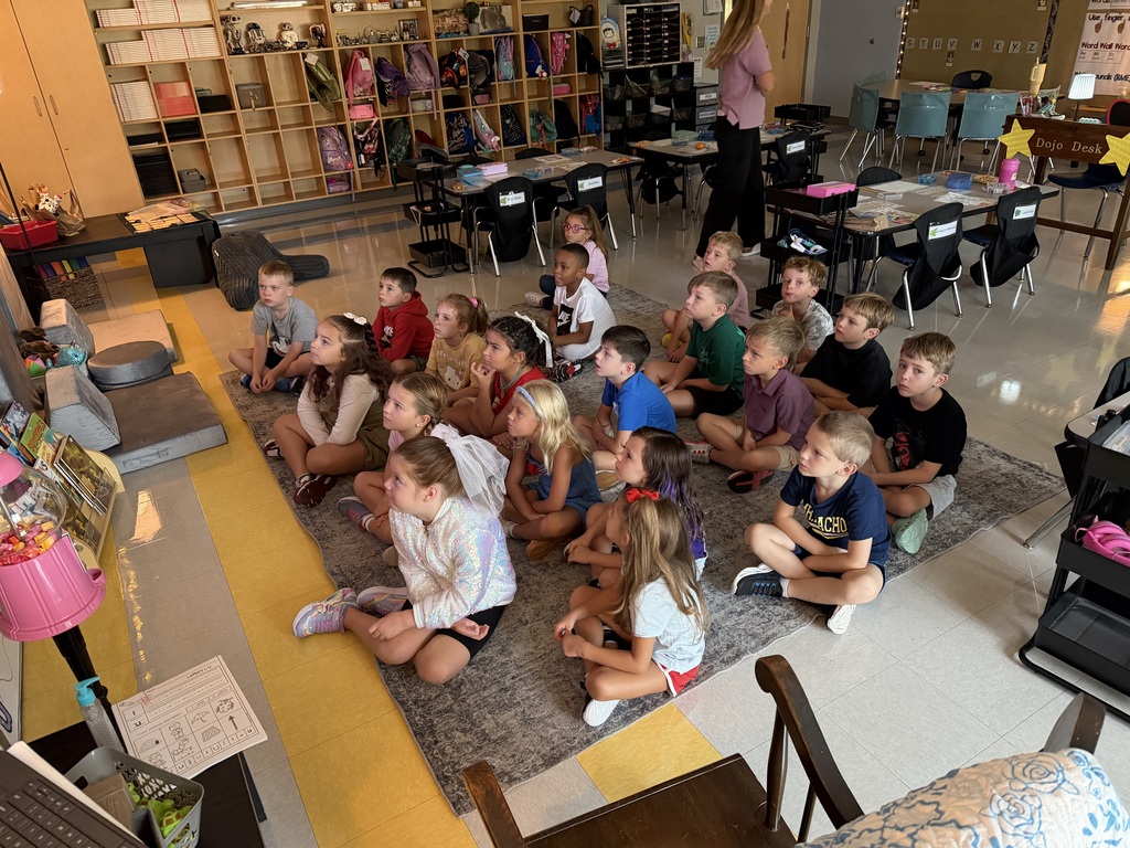 students watching a bus evacuation drill