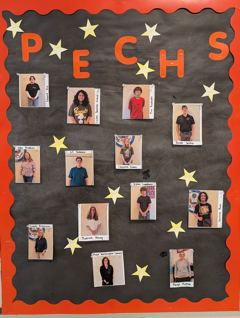 Bulletin board with pictures and names of students and staff of the month