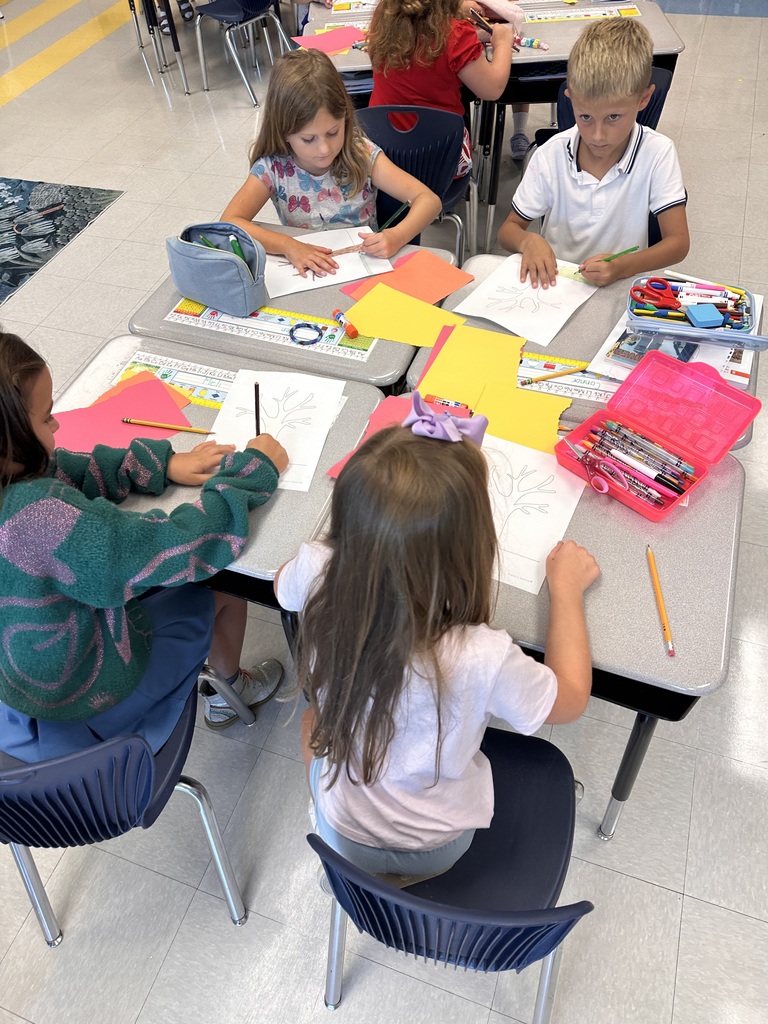 2nd grade students working at their tables