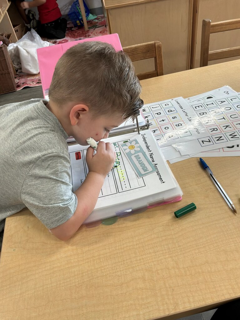 Pre- K Scholar Writing His name 