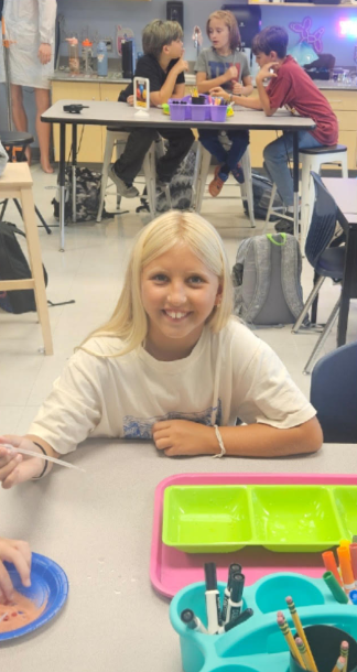 5th graders working on a science experiment