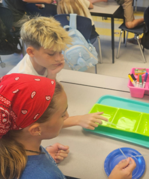 5th graders working on a science experiment