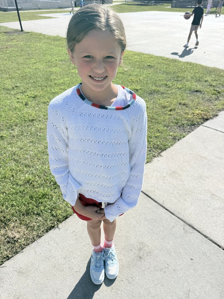 student wearing red white & blue