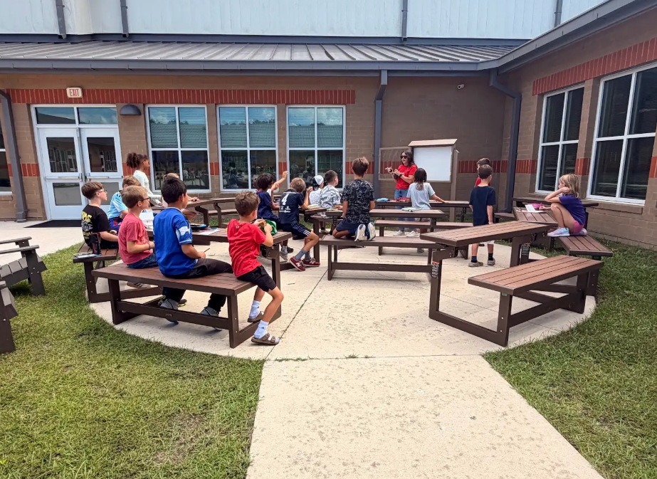 4th graders working outside at the outdoor classroom