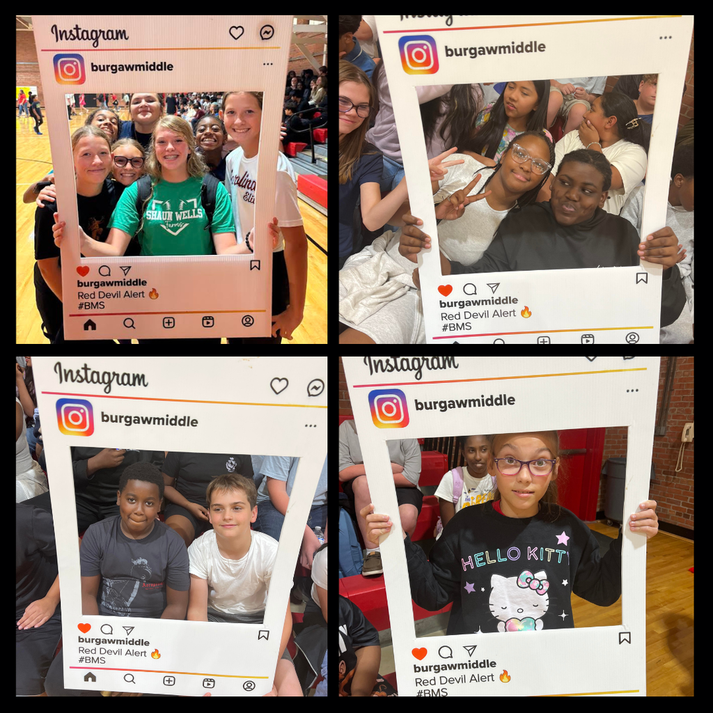 teachers and students at pep rally holding instagram sign