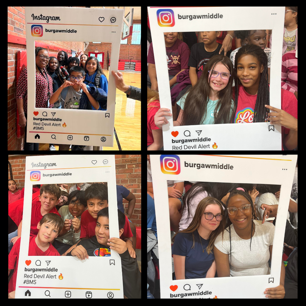teachers and students at pep rally holding instagram sign