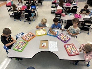 first graders playing a CVC word game