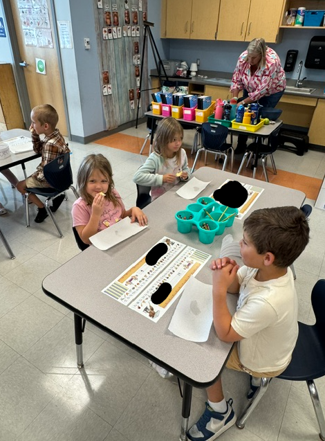 Kindergarten working on apple taste testing graph