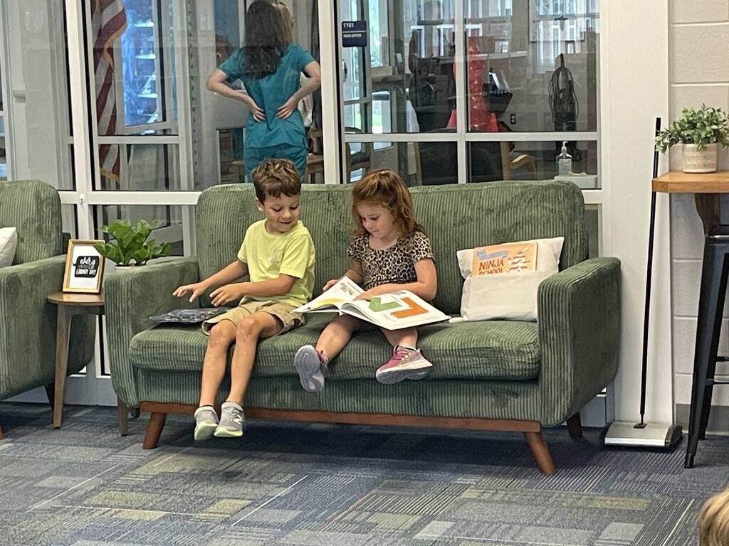 students reading on couches in the library