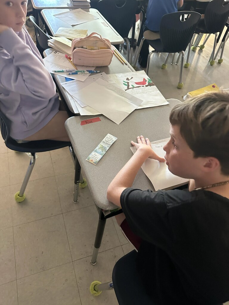 4th graders working on a project at their tables