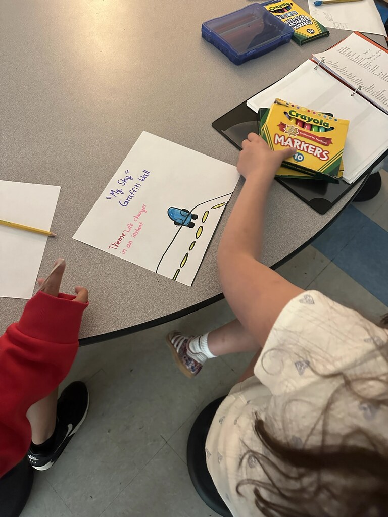 4th graders working on a project at their tables