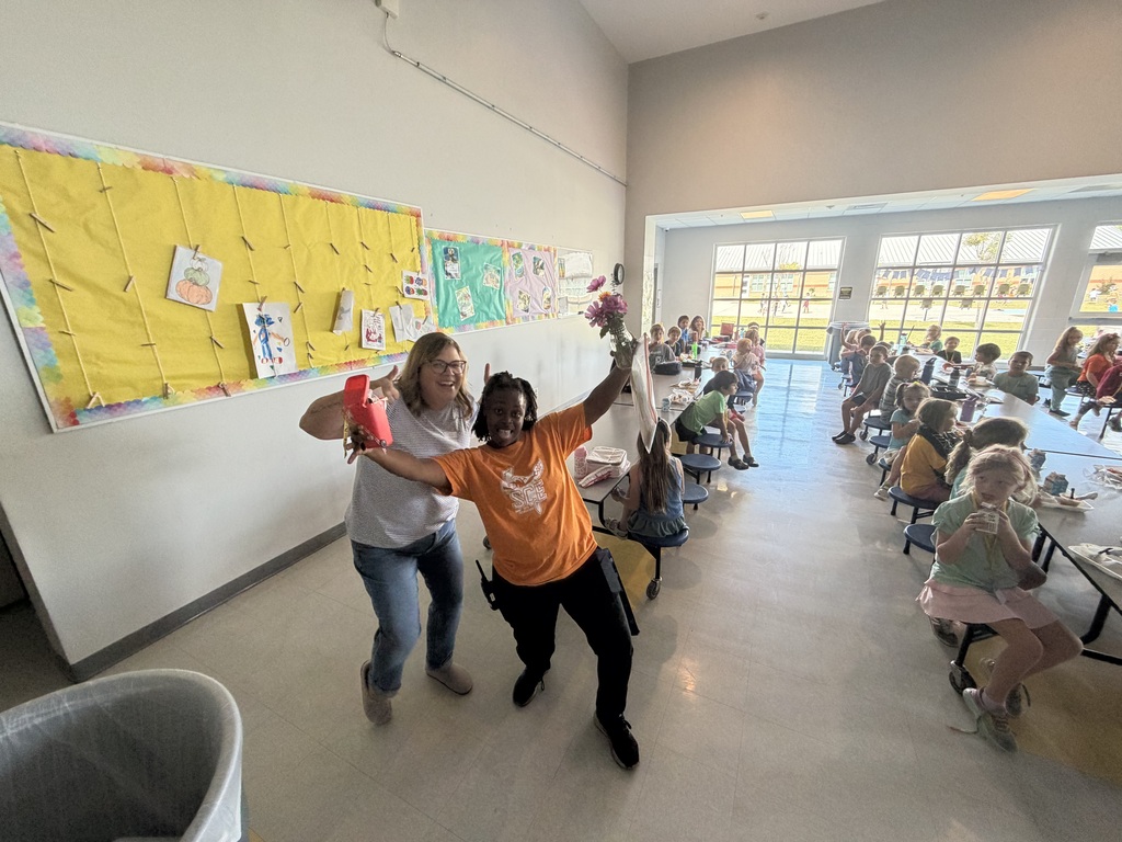 celebrating a custodian in the lunch room with elementary students