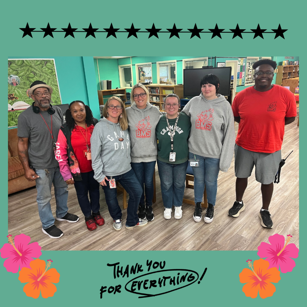 staff posing in library