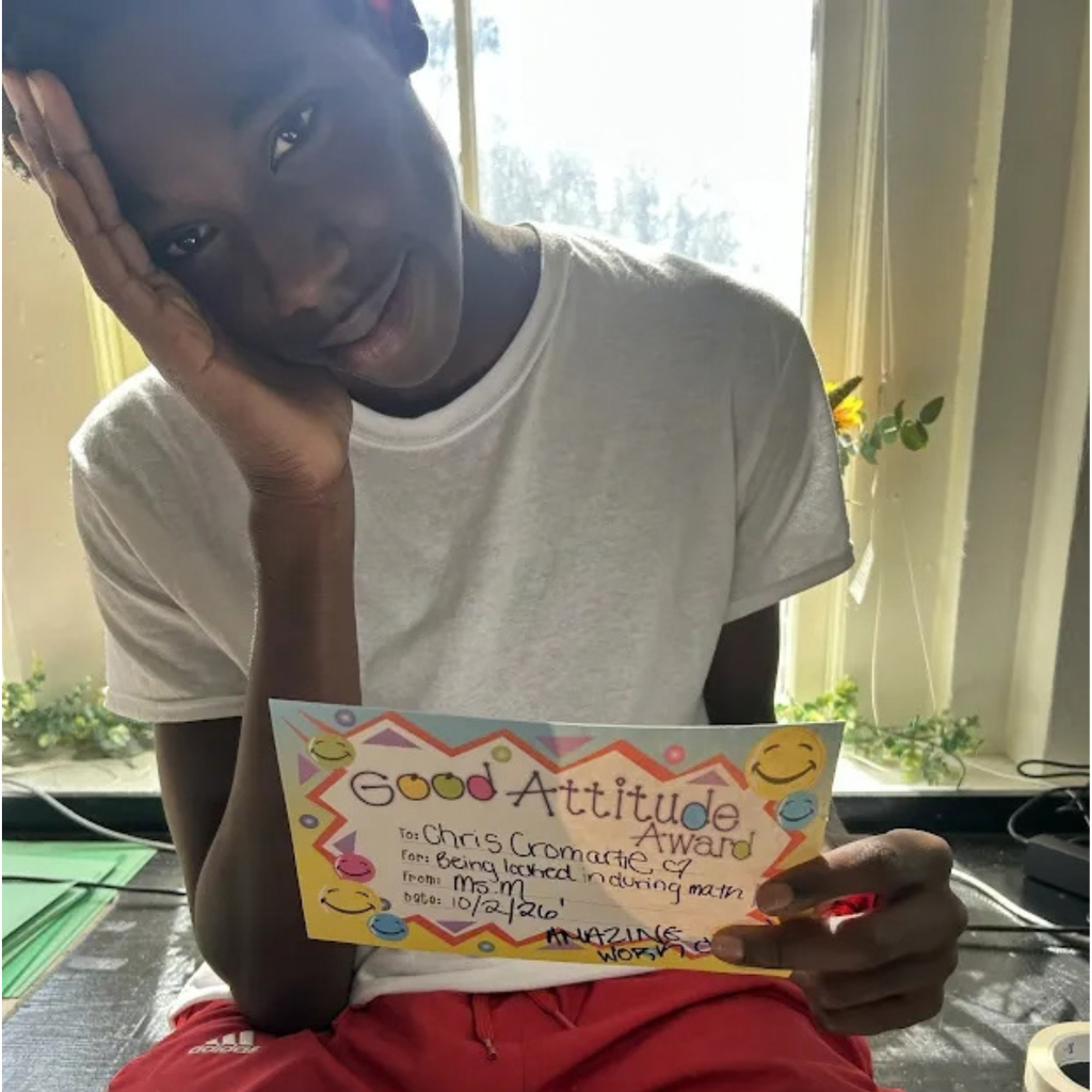student holding certificate