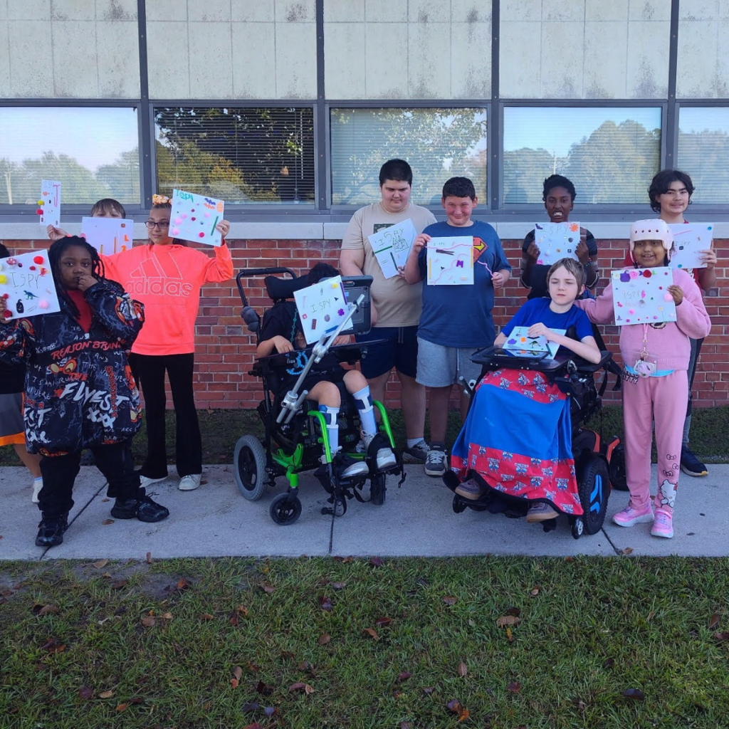 students outside at school conducting  I SPY activitiy