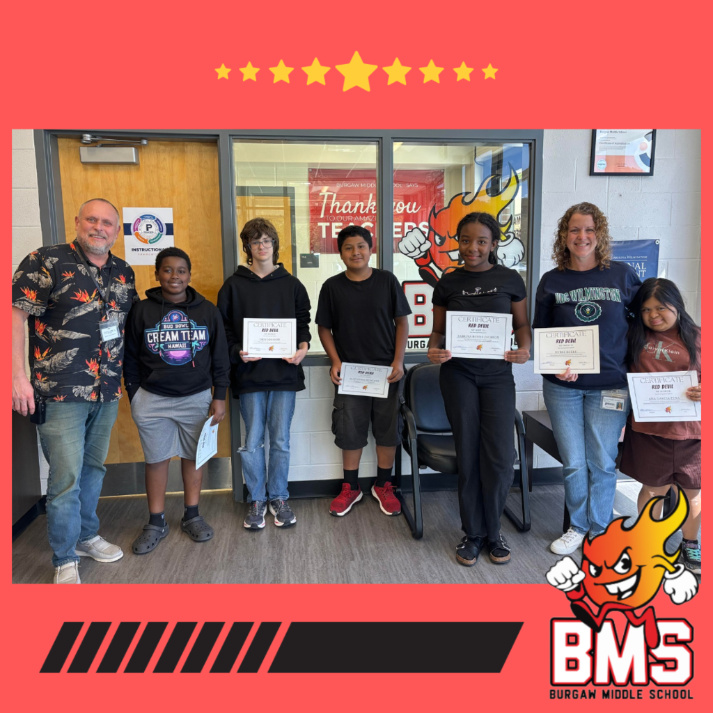 October Red Devils of the month posing - teachers and students holding certificates
