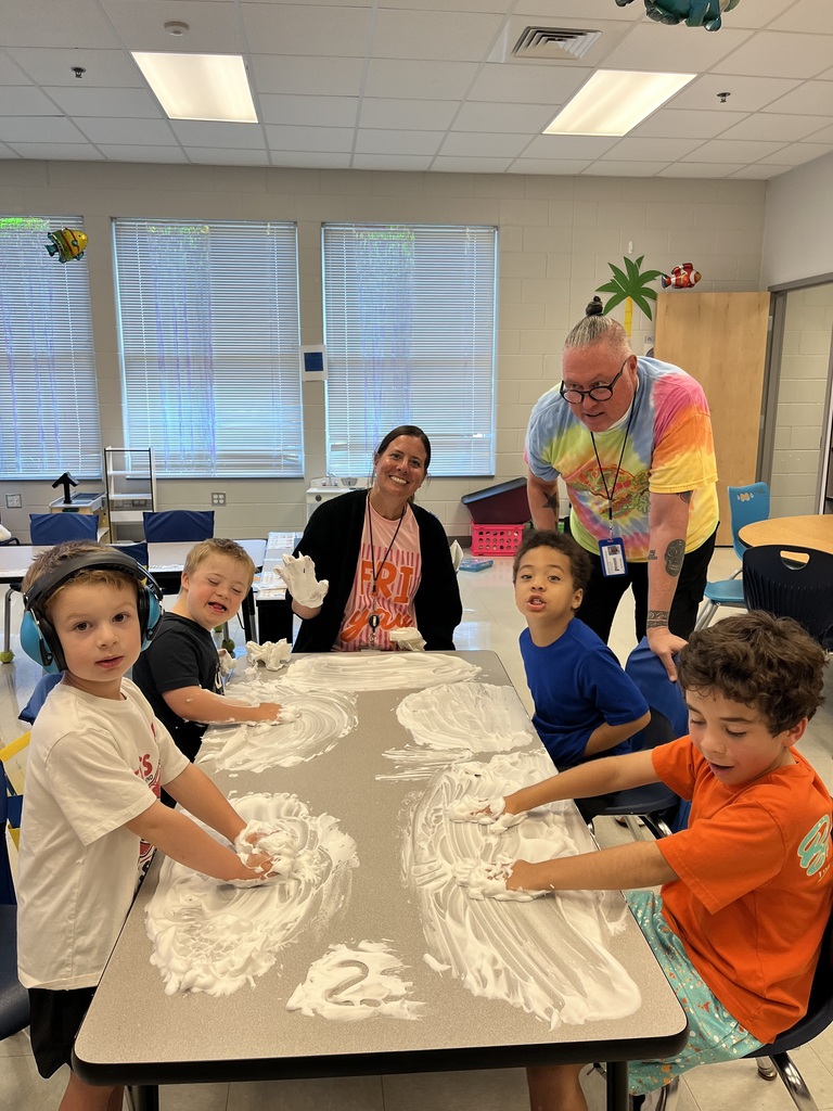 students using shaving cream to practice numbers