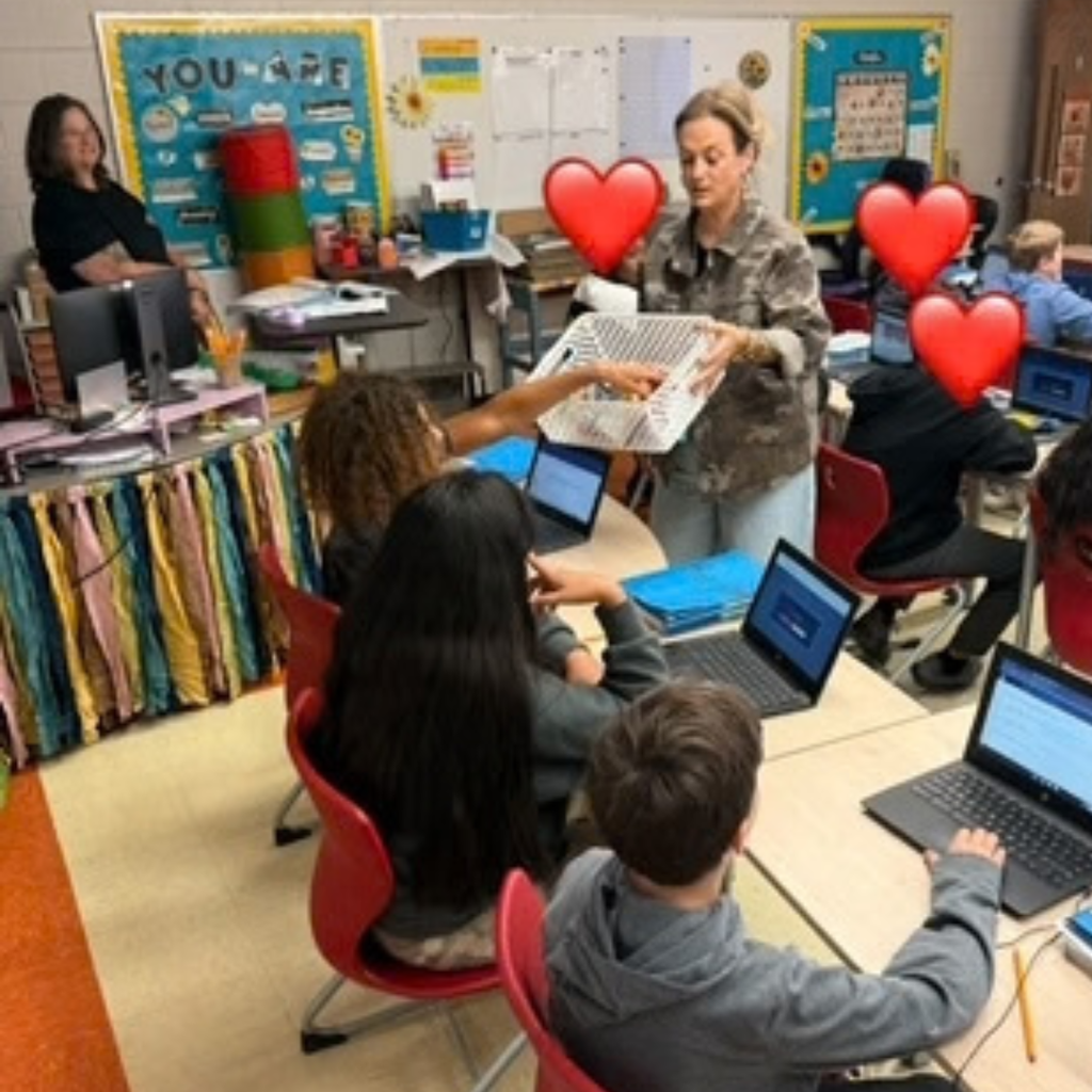 students receiving recognition in classroom